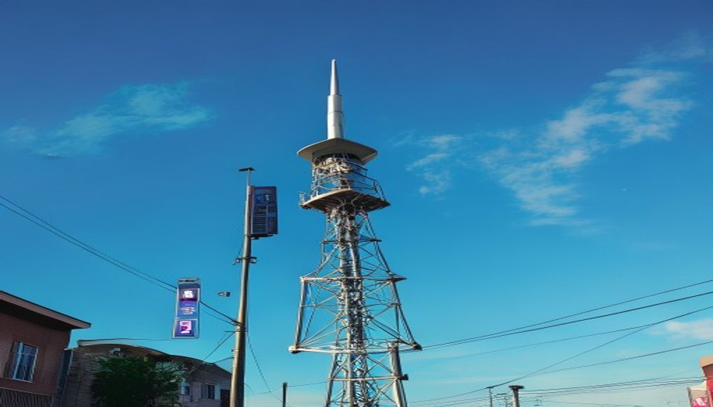 5G tower against blue sky in editorial style