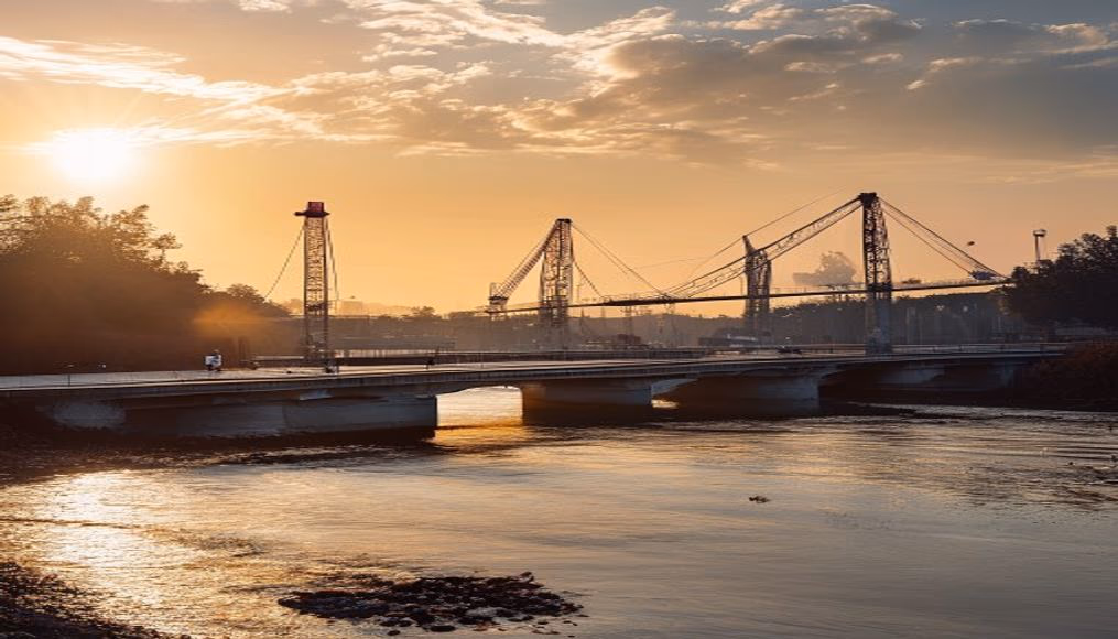 bridge construction site with cranes over river in editorial style