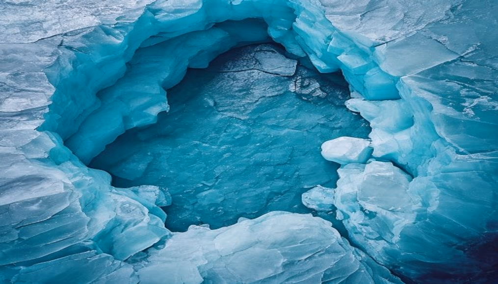 glacier blue ice cave in editorial style
